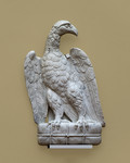 Aquila di Calimala con ali chiuse, torsello, becco a sinistra